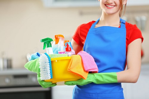 Oven cleaner in Acton cleaning racks and interior surfaces